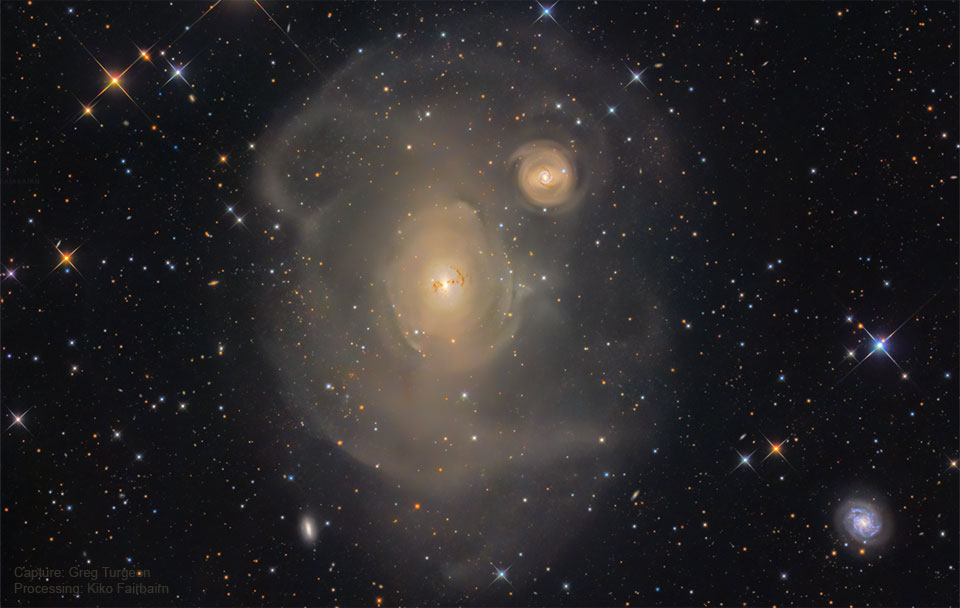 The featured image shows a deep image of the giant elliptical galaxy
NGC 1316 featuring many concentric shells which embed a smaller galaxy.
Please see the explanation for more detailed information.