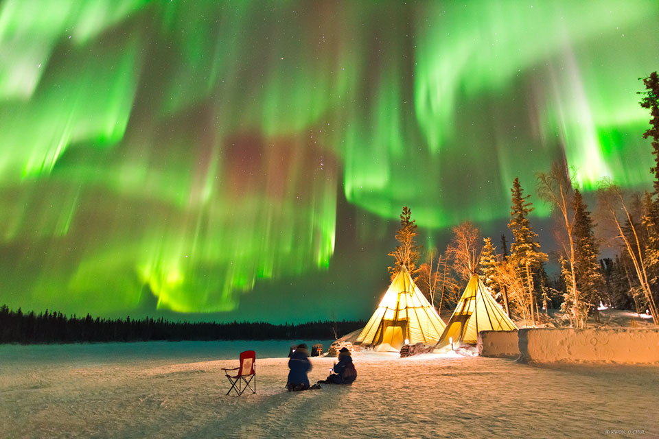 The featured image tipis below a night sky lit up
with multiple green aurorae.
Please see the explanation for more detailed information.