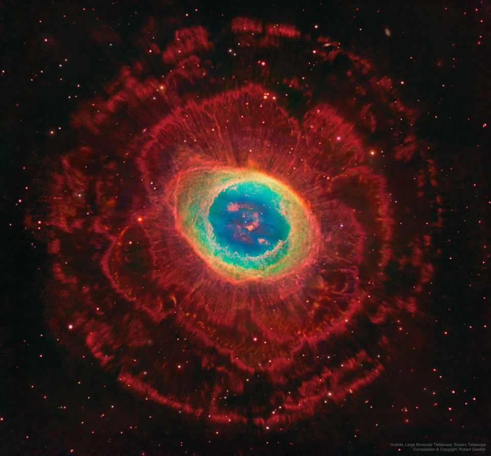 In the centre is a colourful nebula, the most usually
seen part of the Ring Nebula. Several layers of red-glowing
gas with different structures are seen surrounding this
centre.
Please see the explanation for more detailed information.