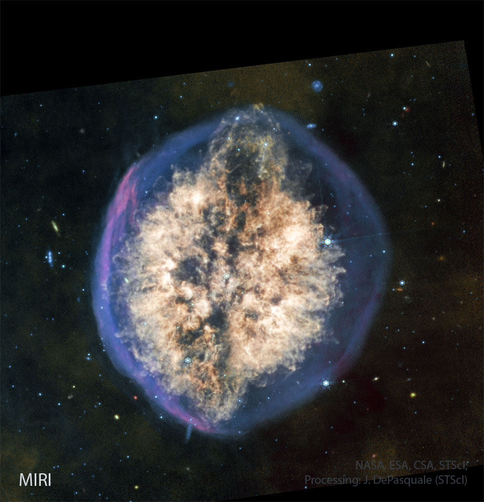 The featured image shows a starfield surrounding a 
nebula that resembles the human brain. A blue outer oval
has a bright nebulosity inside. 
Please see the explanation for more detailed information.